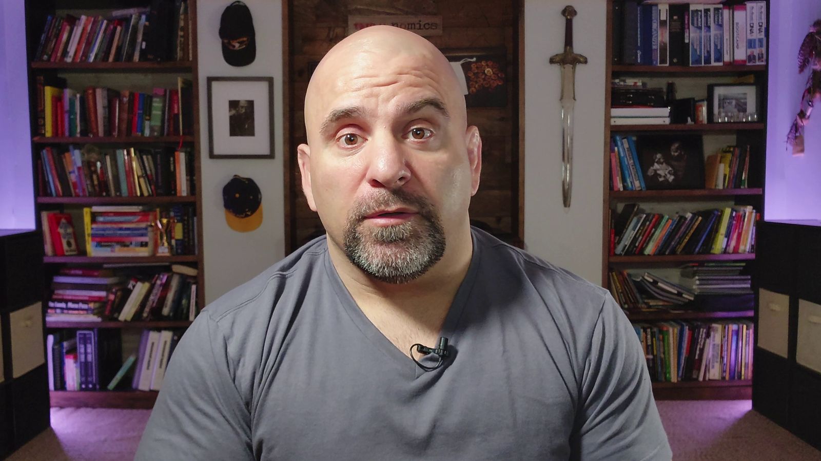 Master Chim in front of his bookshelves